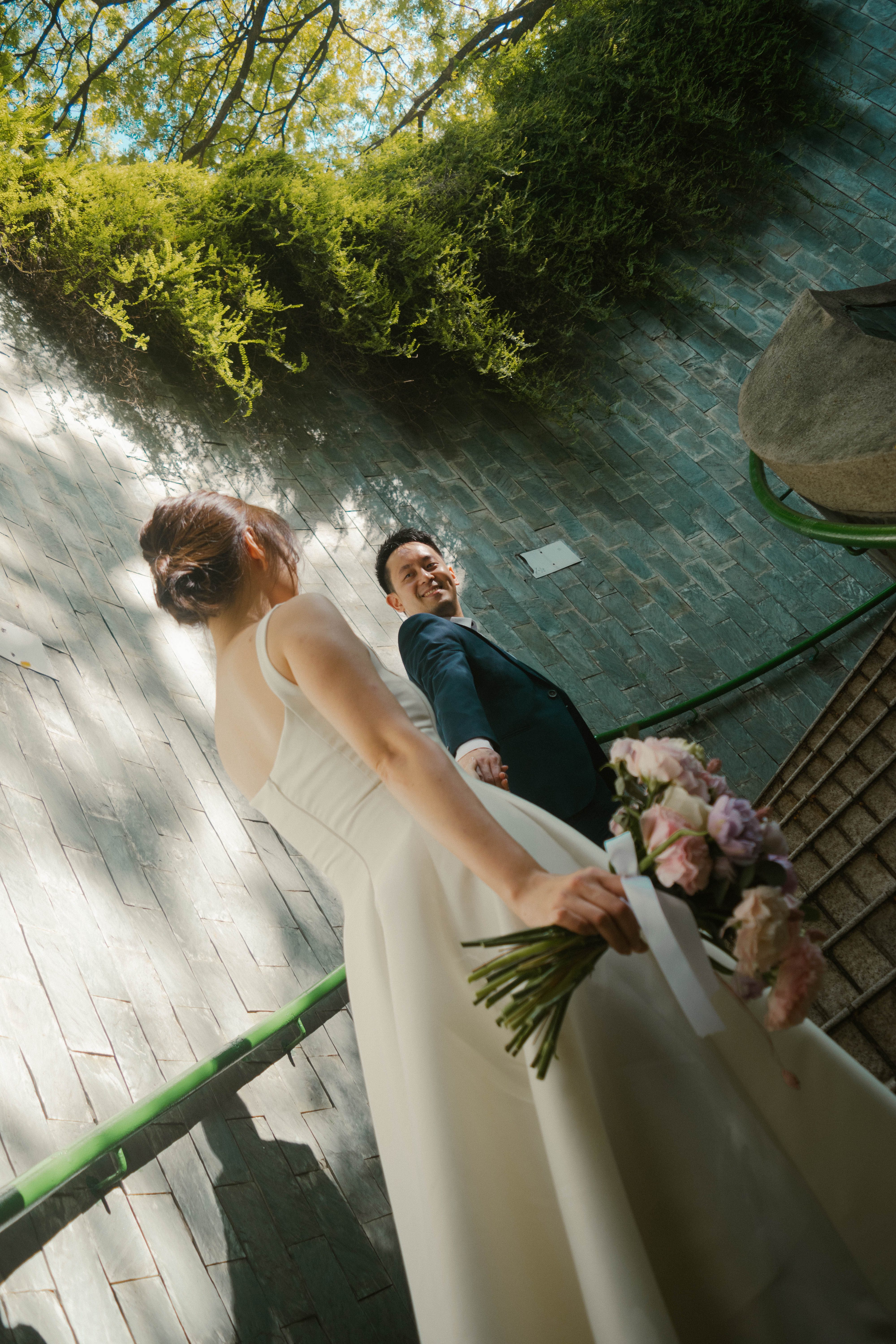 Couple walking through a quiet city block